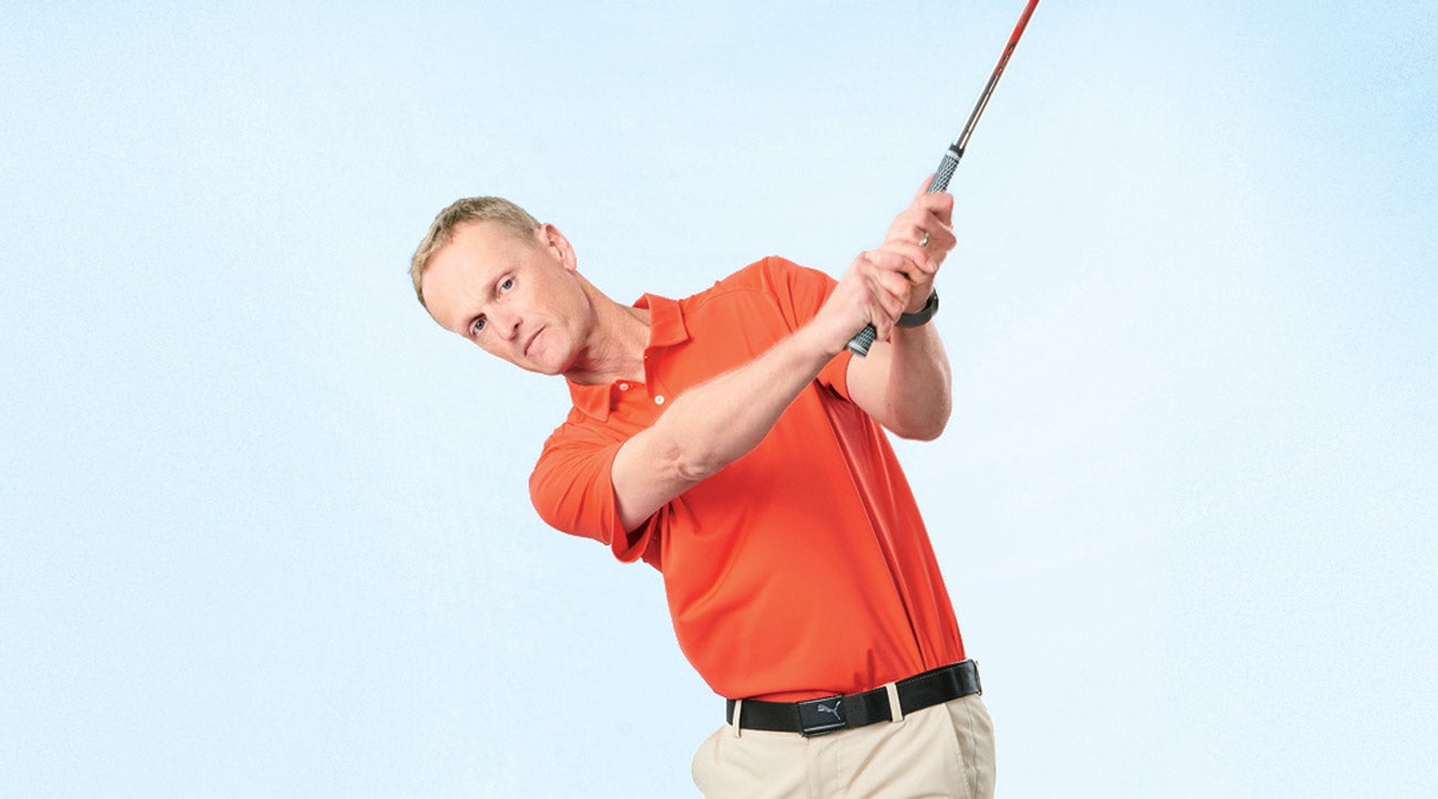 Reverse your grip in practice to groove an iron-crushing hand path.