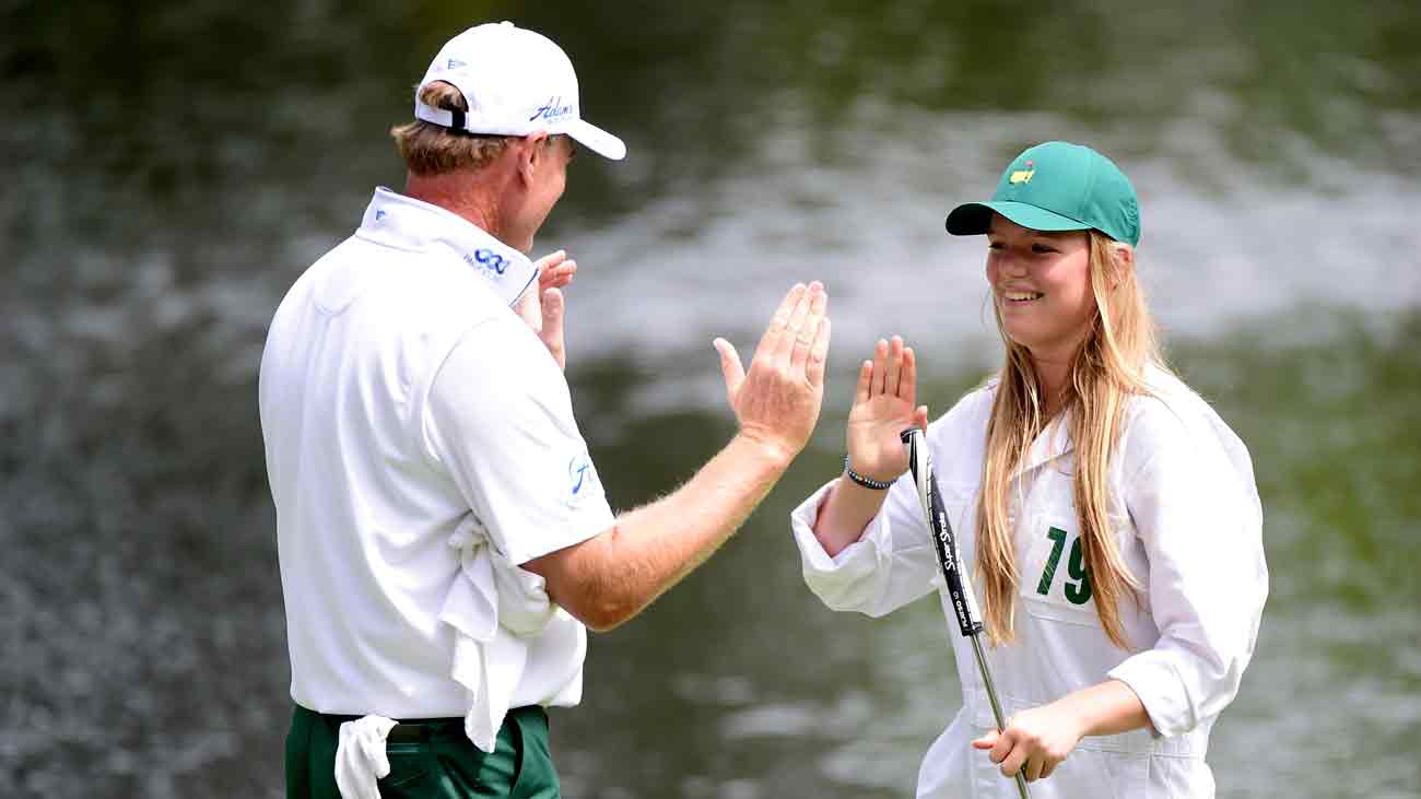 Ernie Els high-fives his daughter, Samantha, during the 2016 Masters Par 3 Contest.