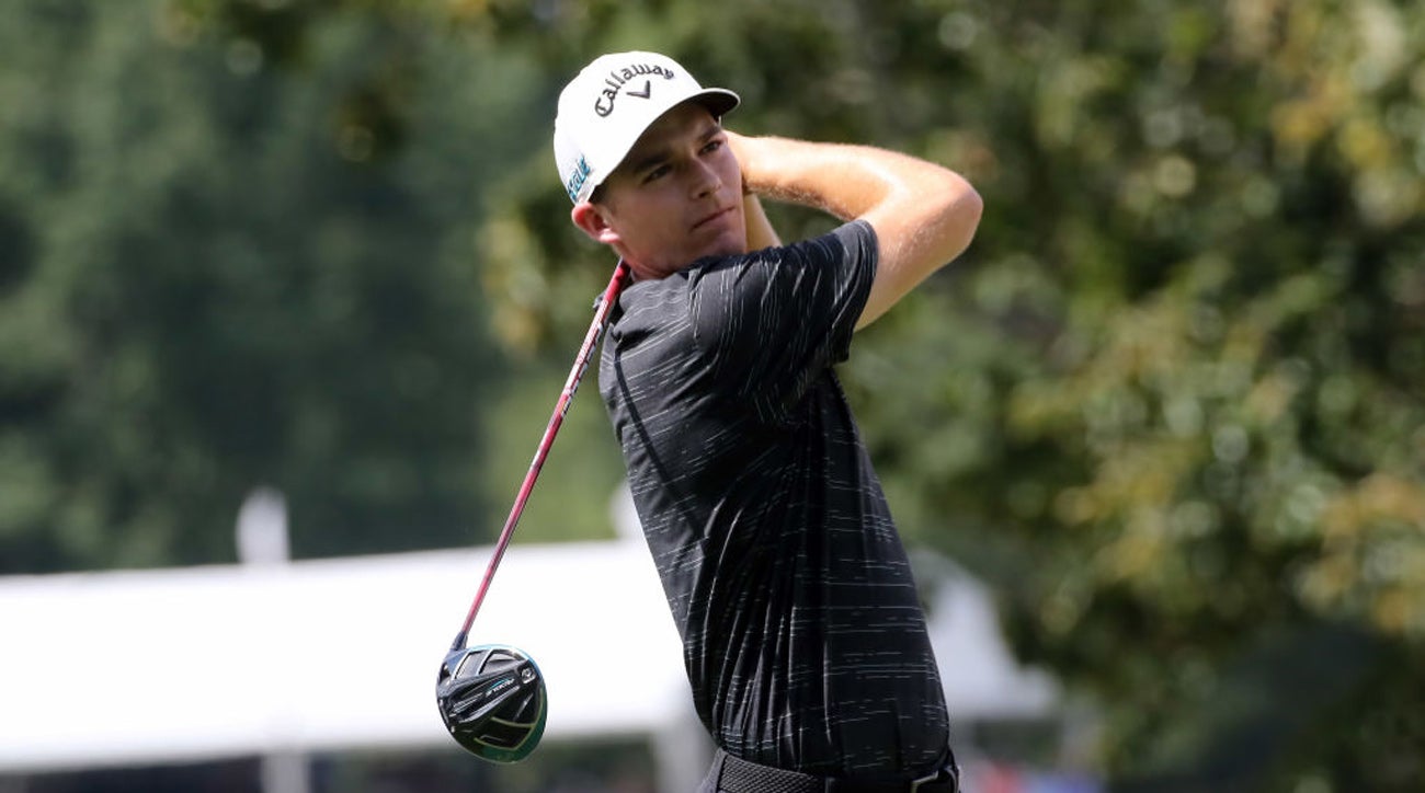 Aaron Wise watches his ball after teeing off.