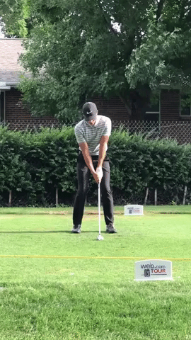 Cameron Champ hits a driving iron at a Web.Com Tour event