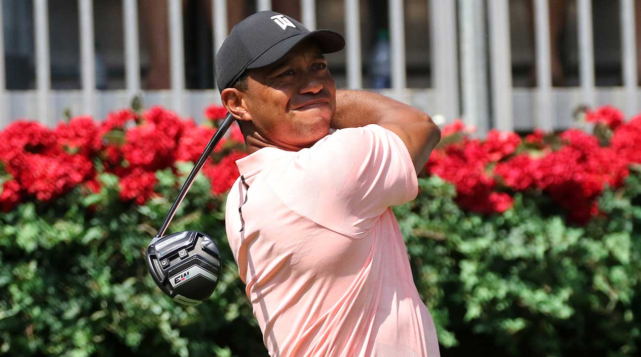 Tiger Woods watches a drive off the tee.