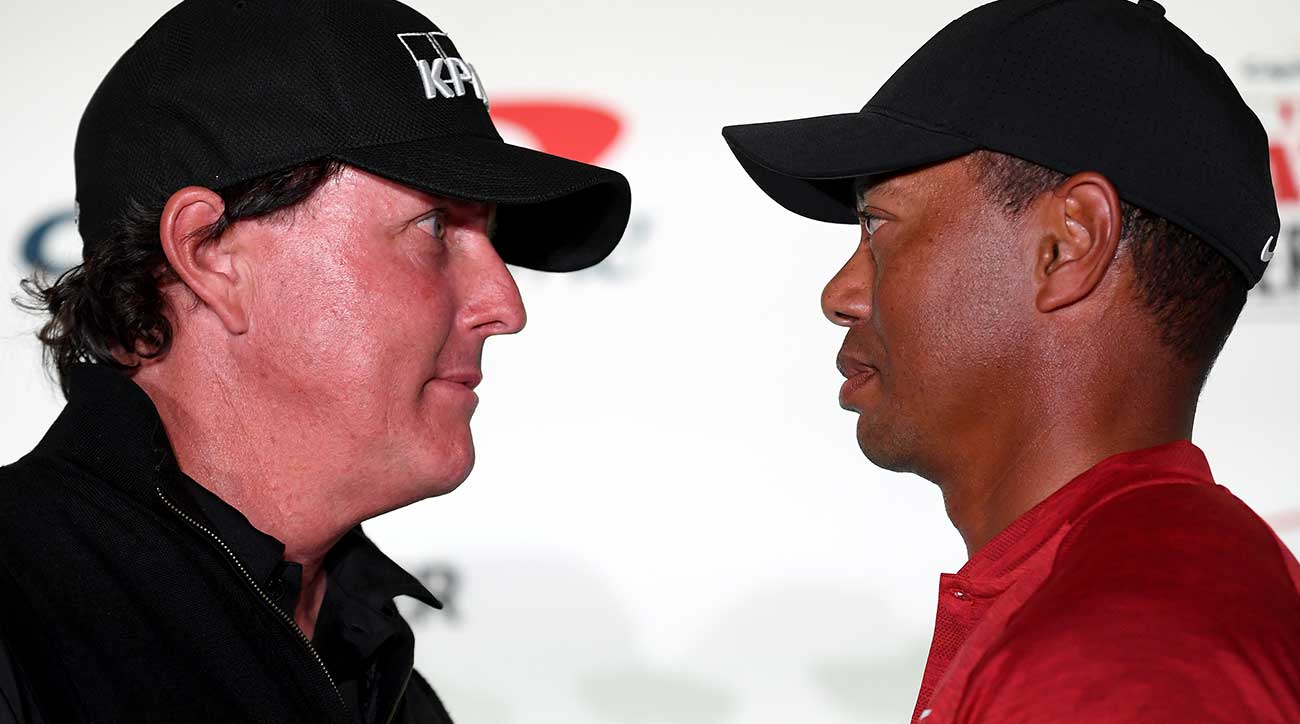 Phil Mickelson and Tiger Woods trade stares at The Match press conference on Tuesday.